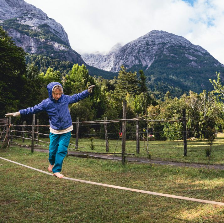 A child balancing on a slackline.