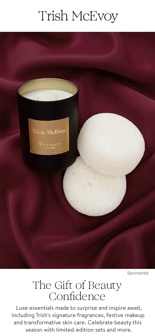 A scented candle and body sponges. Three bottles of perfume. A scented body cream.