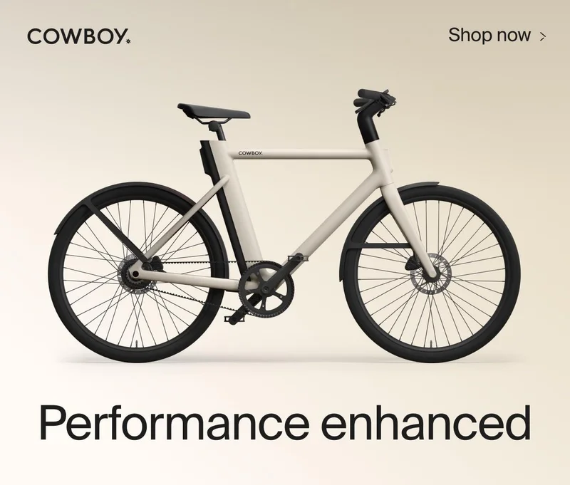 A graphic. A Cowboy Cruiser model is shown with the company log. Text above the product reads "Shop Now", and a title text below reads "Performance enhanced"