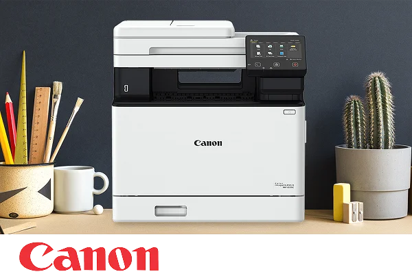 A Canon multifunction printer on an office desktop.