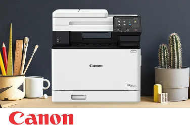 A Canon multifunction printer on an office desktop.