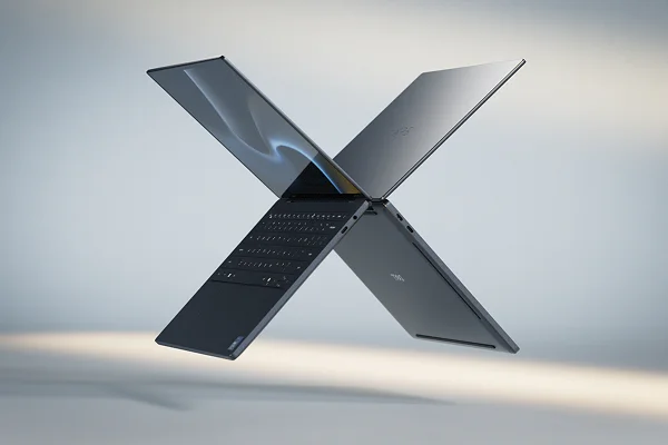 Two Dell XPS laptop computers floating in midair in the shape of the letter “X”.