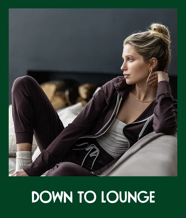 Woman wearing vuori sweatshirt and joggers.