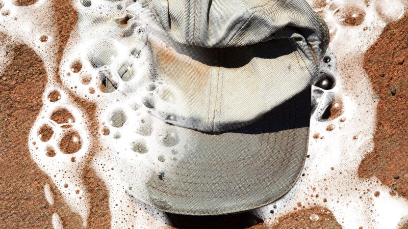 Image may contain: Baseball Cap, Cap, Clothing, Hat, and Person