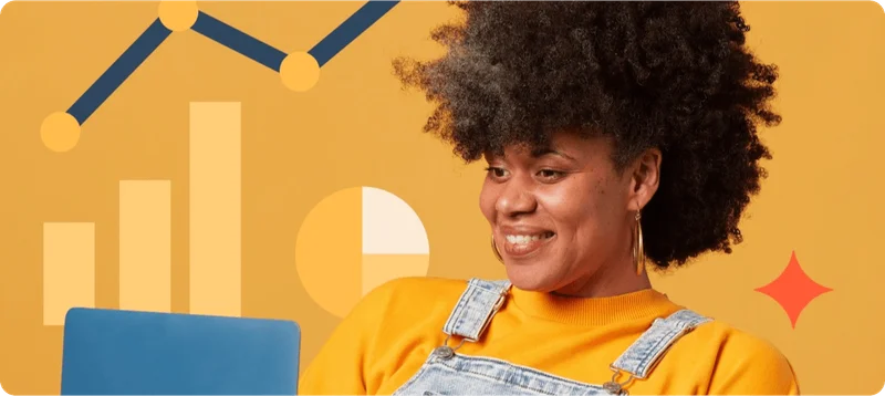 A woman smiling at a laptop