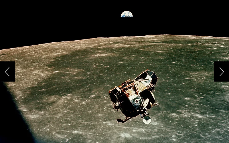 Riding to rendezvous with a half earth in sight, Armstrong and Aldrin guide Eagle to its docking with Columbia. 'Absolutely beautiful,' said Collins. The eastern rim of the moon lies 70 miles below.