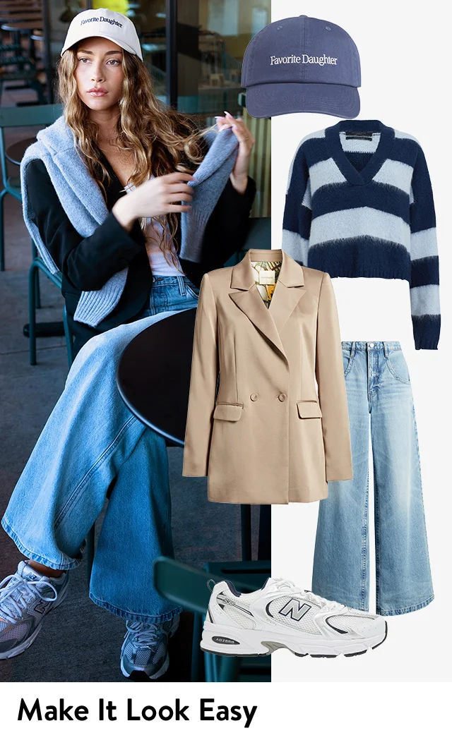 Woman wearing wide-leg jeans with a blazer, sneakers, sweater and baseball cap. An embroidered baseball cap, double-breasted blazer, blue striped sweater and wide-leg jeans.