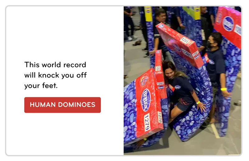 An action shot of the Uratex team breaking the world record for a human dominoes line.