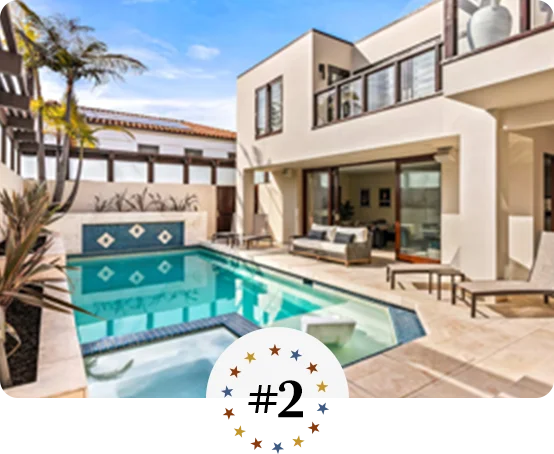 Contemporary home with private pool, sun loungers, and modern outdoor seating area.