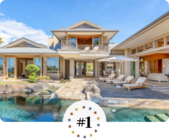 Luxury tropical villa with open-air design, poolside loungers, and scenic views.