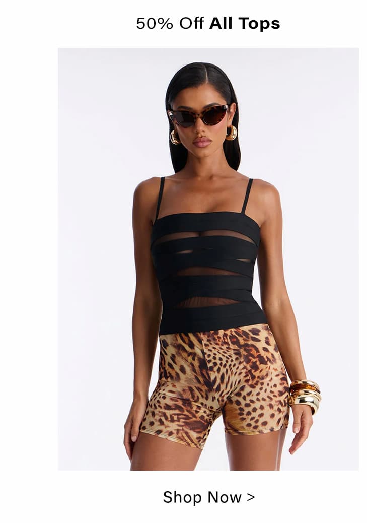Shop 50% off women's tops! Model wears black sheer strappy top & leopard print shorts.