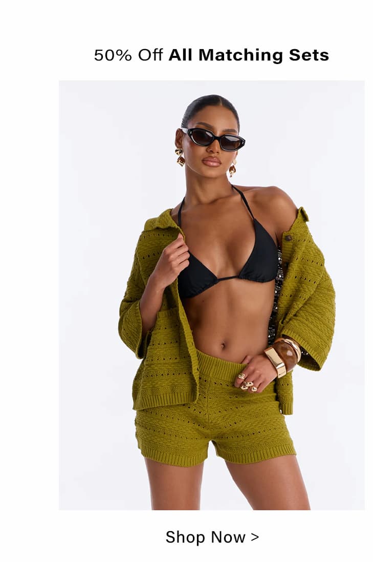 Woman in olive green knit cardigan, matching shorts, and bikini. Shop 50% off matching sets & resort wear.