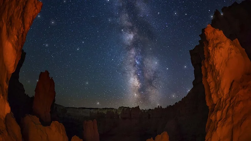 Image description: The Milky Way glowing over Bryce Canyon National Park.