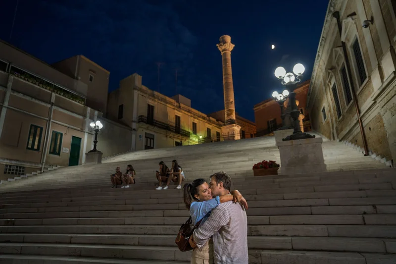 A couple embraces at the Port of Brindisi in Italy. Scientists have shown that being in love activates the brain's reward center and can lead to measurable benefits such as reducing your stress and pain as well as improving your sleep and your problem-solving abilities. It is even linked to a longer life.
