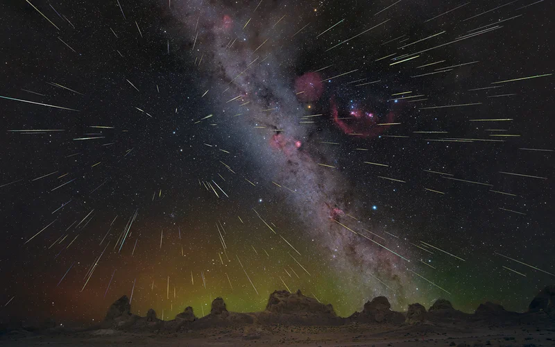 Hundreds of Geminid meteors blaze across the night sky above the Trona Pinnacles in California in a composite image from 2023