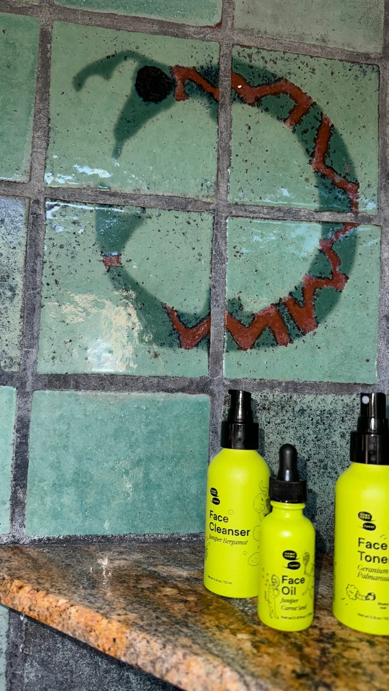 Green bottles against a green tiled backdrop