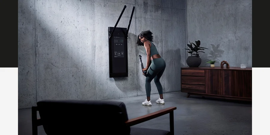 A woman working out with Tonal 2