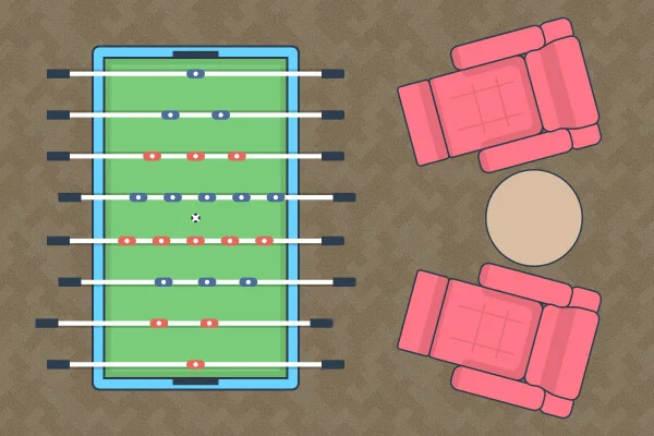 A table football and recliner chairs