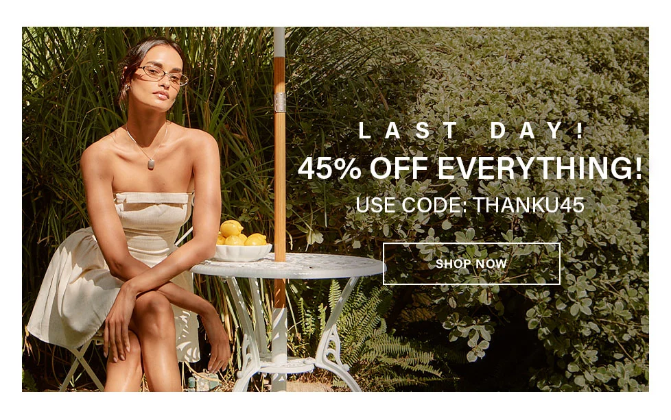 Woman in beige strapless dress and glasses seated outdoors. Last day: 45% off everything for a limited-time sale with code THANKU45. Shop now.