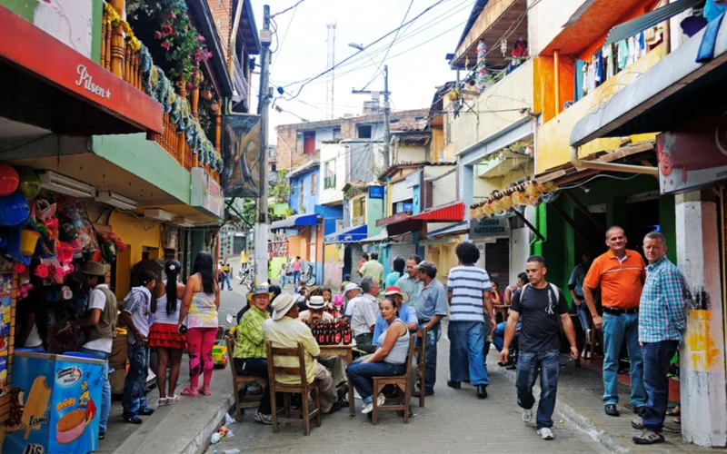 Comuna 13, a neighborhood with an arduous history, is reinventing itself with colorful murals, performances, and restaurants.