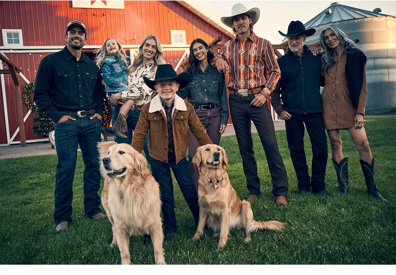 People with dogs posing