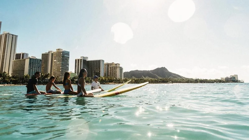 Image description: Family surf lessons at Waikiki Beach, Oahu
