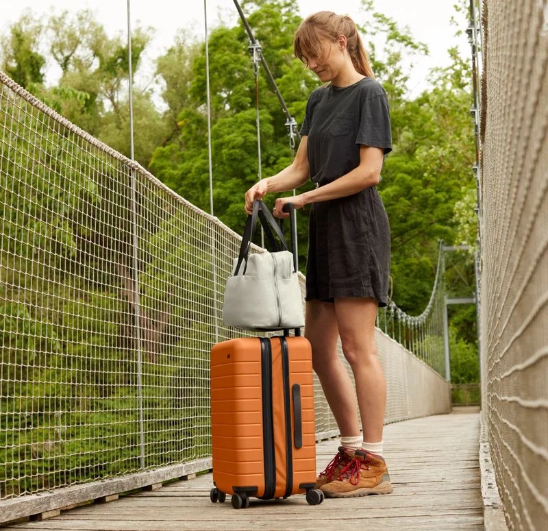 MADE OF: Impact-resistant polycarbonate shell with added zipper expansion