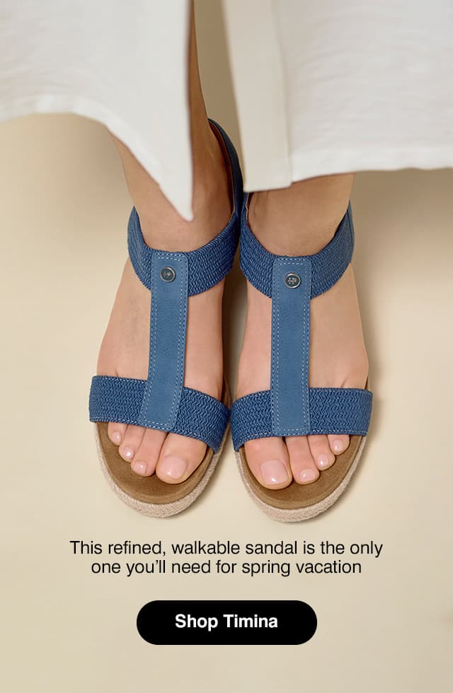An overhead view of the Timina Sandal in Blue Breeze on foot paired with a white midi dress. The text says This refined, walkable sandal is the only one you’ll need for spring vacation
