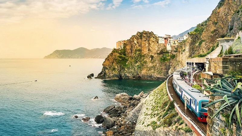 Image description: Train with view of ocean, in Manarola, Cinque Terre, Italy