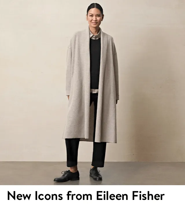 A woman wearing a gold button-front blouse with black pants. A woman wearing a grey coat with a black top and pants.