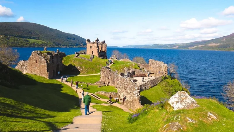Image description: Tourists at Loch Ness, Scotland.