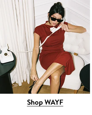 A woman wearing a red party dress.