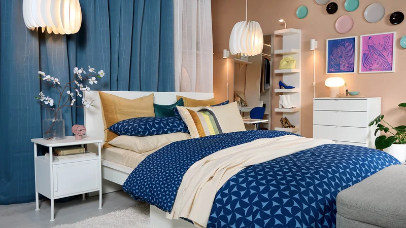 Bedroom with blue curtains and bedding