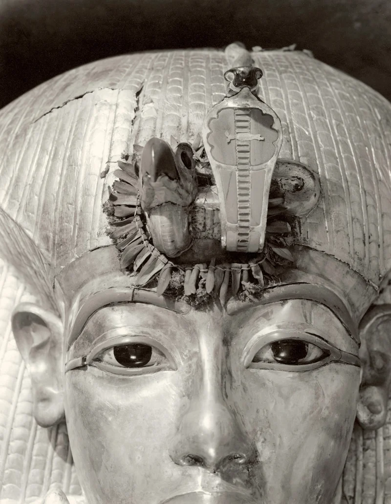 Staring from the lid of Tut’s outermost coffin, the king’s golden effigy looks eerily alive thanks to eyes of calcite and obsidian. A garland of flowers and olive leaves still adorned the vulture and cobra insignia more than 3,000 years after the young pharaoh was laid to rest.