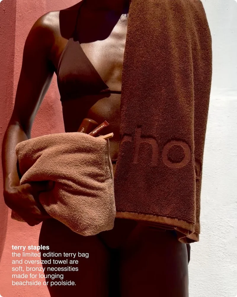 terry staples​ - the limited edition terry bag and oversized towel are soft, bronzy necessities made for lounging beachside or poolside.