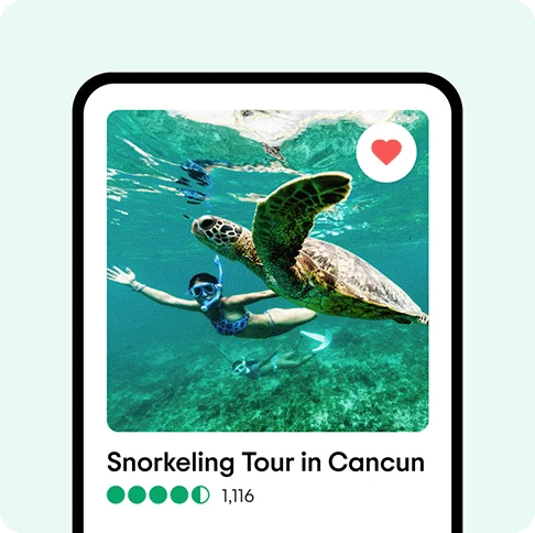 Image description: A phone with a person snorkeling next to a turtle on its screen. A heart is in the top right corner.