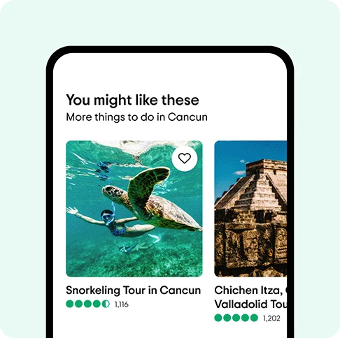 Image description: A phone with ideas for things to do in Cancun on its screen including a snorkeling tour with a turtle and a Chichen Itza tour.