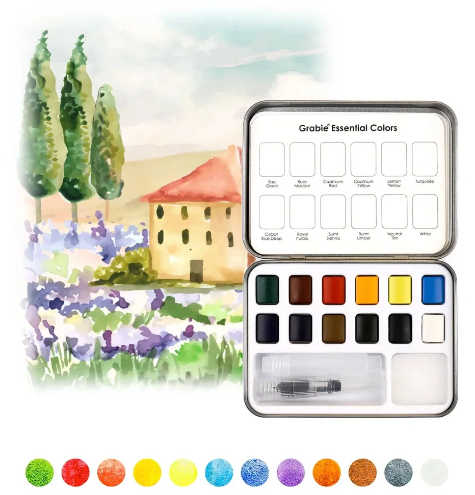 Watercolor set in front of a watercolor drawing of a house and trees