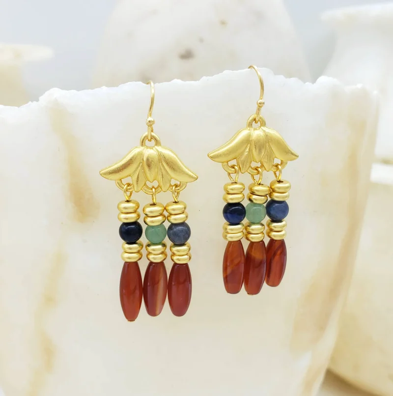 Gold lotus earrings with red, blue, and green beads