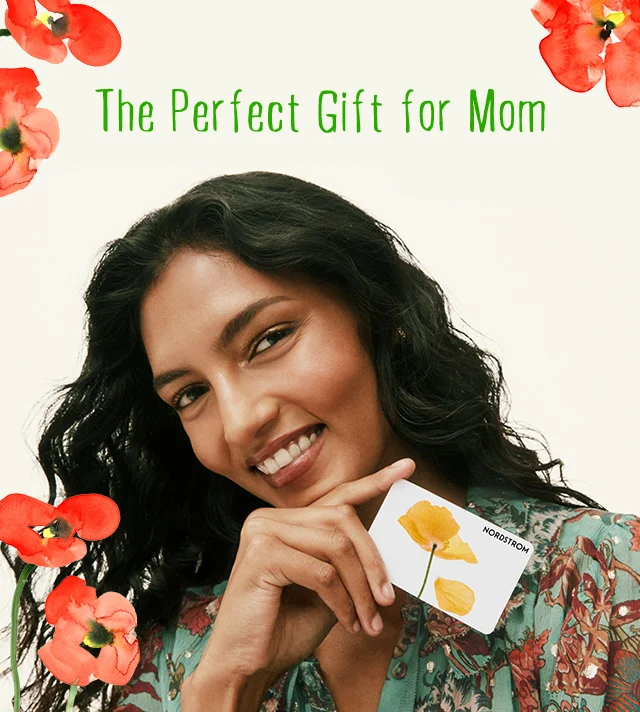 Woman holding a Nordstrom gift card.