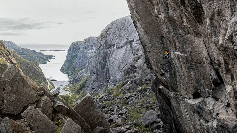 A person climbing on a rock wall.