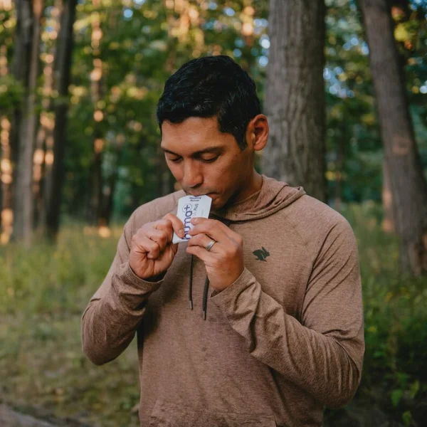 Man eating an energy gel