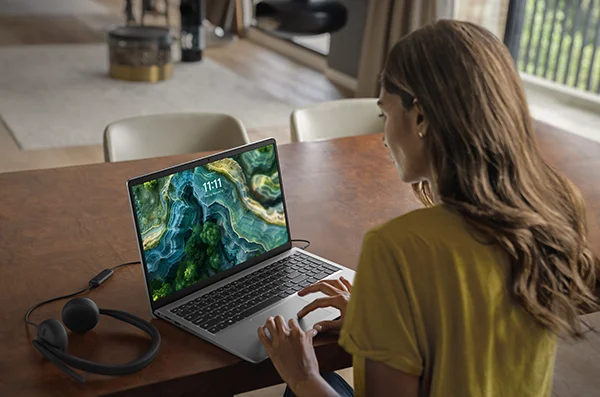Woman Working on a Dell 15 Laptop