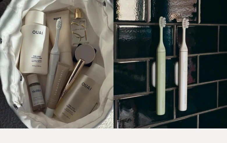 Sea Mist in a travel bag, a pair of SURI brushes mounted on the wall in a dark-tiled bathroom