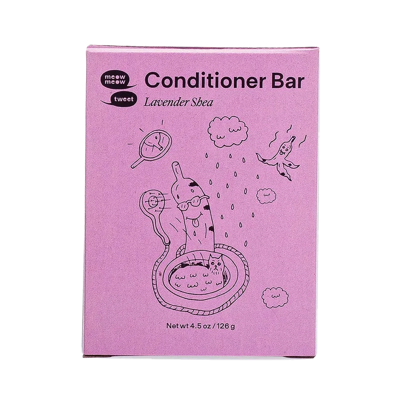 A purple box with a cat in a sink with a silly banana over it