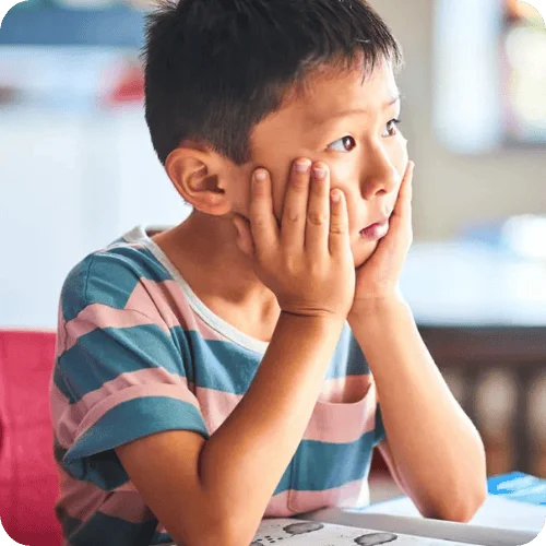 boy in classroom learning hard lessons boy in classroom learning hard lessons