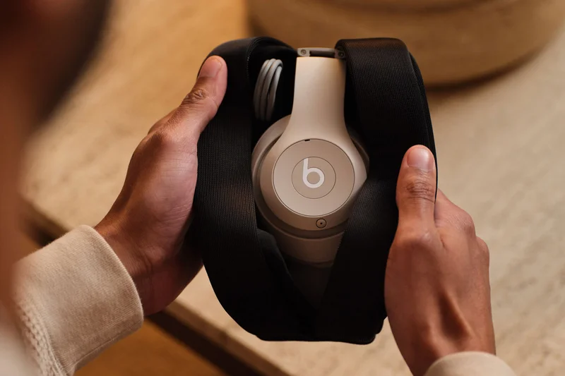 Person holding Beats Studio Pro in Sandstone