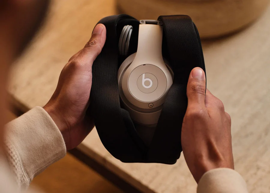 Person holding Beats Studio Pro in Sandstone