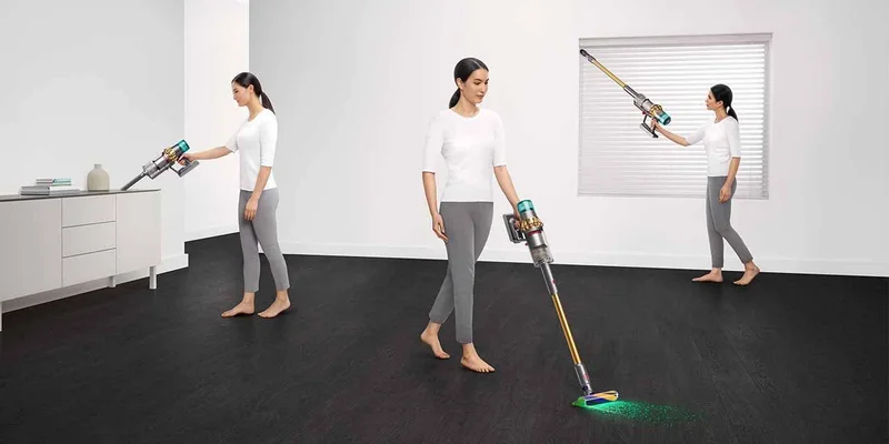 The Dyson V15 Detect Absolute vacuum being used by a woman
