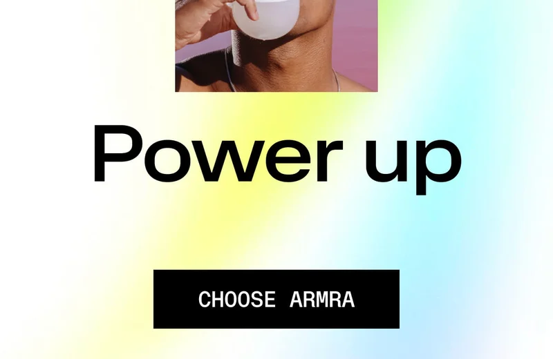 Power up. CHOOSE ARMRA. Person drinking from a white cup with colorful gradient background.